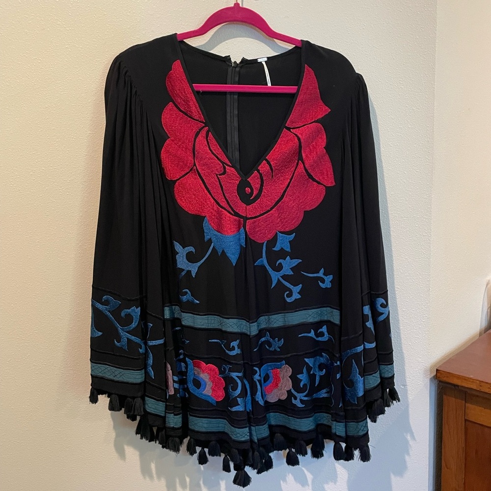 Free people island romper with tassels